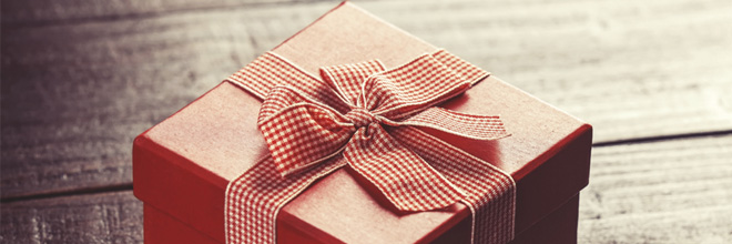 Red gift box on wooden table